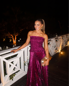 Berry glitter strapless maxi dress with fitted bodice and floor-length flared hem