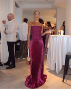 Berry glitter strapless maxi dress with fitted bodice and floor-length flared hem