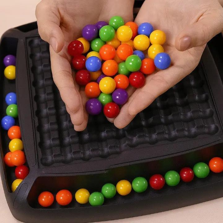 Black screen-free strategy board game with colorful round game pieces