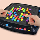 Black screen-free strategy board game with colorful round game pieces
