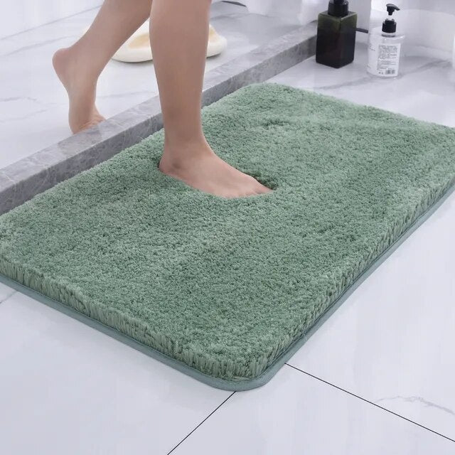 Soft microfiber non-slip bath mat beside a bathtub