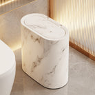 Modern oval lidded trash can with decorative patterned exterior