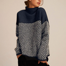 Women's relaxed turtleneck sweater with geometric chevron pattern and long sleeves