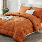 Quilted comforter with geometric diamond stitching on a bed
