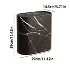 Modern oval lidded trash can with decorative patterned exterior