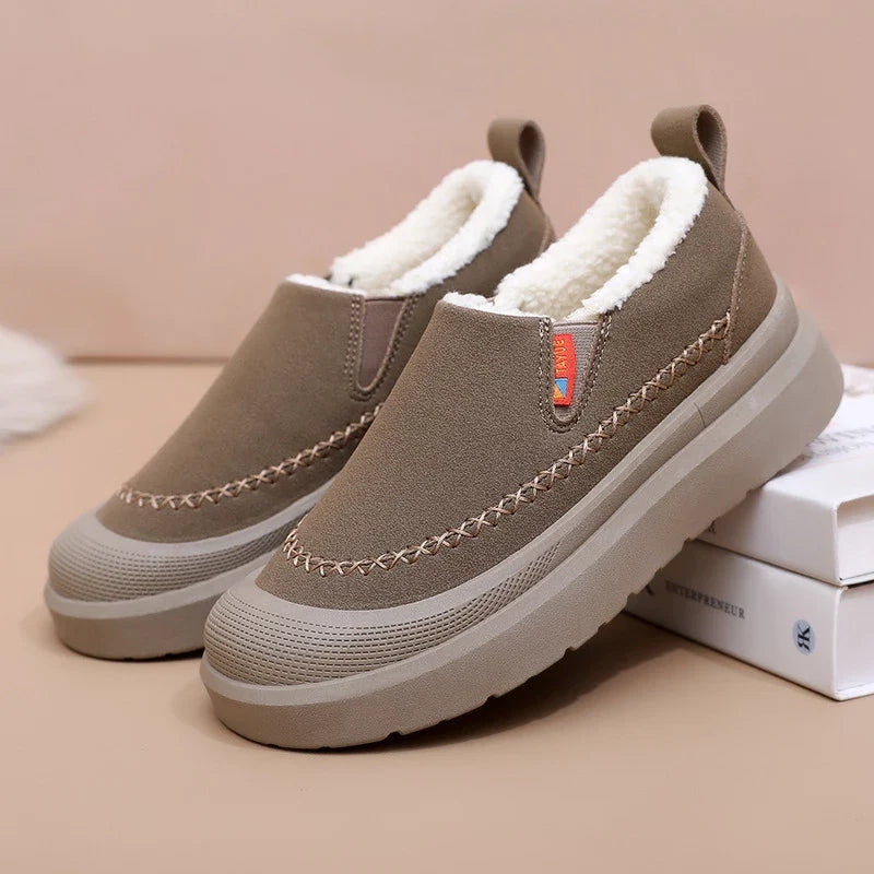 Women's slip-on shoes with plush lining, rounded toe, and layered sole
