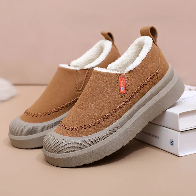 Women's slip-on shoes with plush lining, rounded toe, and layered sole