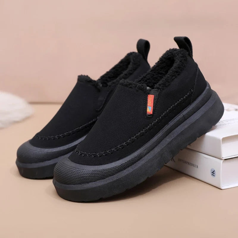 Women's slip-on shoes with plush lining, rounded toe, and layered sole