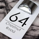 Personalized rectangular house number plaque with raised metallic lettering